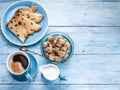 Cup of coffee, milk jug, cane sugar cubes and fruit-cake. Royalty Free Stock Photo