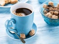 Cup of coffee, milk jug, cane sugar cubes and fruit-cake. Royalty Free Stock Photo