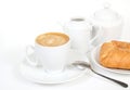 Cup of coffee, milk jug and fresh bakery Royalty Free Stock Photo