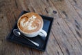 A cup of coffee mocha on wooden