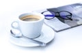 Cup of coffee in morning with newspaper and glasses Royalty Free Stock Photo