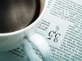 A cup of coffee and a newspaper Royalty Free Stock Photo