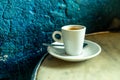Cup of coffee in a nice hipster cafe. Soft focused image.