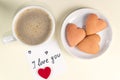 Cup of coffee, and a note with the words I love you on pastel yellow color. Valentine`s Day breakfast. Valentine`s day concept Royalty Free Stock Photo