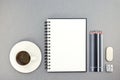 Cup of coffee and notebook with drawing tools on desk Royalty Free Stock Photo