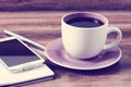 Cup of coffee, notepad, pen and a smartphone Royalty Free Stock Photo