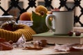 Cup of coffee old book glasses and autumn leaves with fruit bask Royalty Free Stock Photo