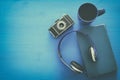 cup of coffee, old book, vintage photo camera and headphones Royalty Free Stock Photo