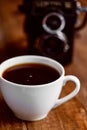 Cup of coffee and old camera Royalty Free Stock Photo