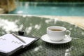 Cup of coffee, organizer and pen on a table Royalty Free Stock Photo