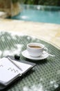 Cup of coffee, organizer and pen on a table Royalty Free Stock Photo