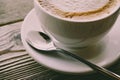 Cup of coffee over wooden table