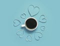 Cup of coffee and paper hearts on red background. St.Valentine`s day greeting concept. Lovely and minimalistic picture. Top view,