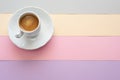 Cup of coffee on pastel color background. Summer flat-lay .