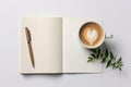 A cup of coffee and a pen on a notebook Royalty Free Stock Photo