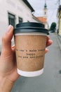 A cup of coffee with a philosophical quote