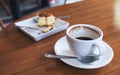 A cup of coffee and a piece of cake on table Royalty Free Stock Photo