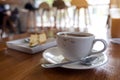 A cup of coffee and a piece of cake on table Royalty Free Stock Photo