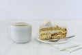 Cup of coffee and piece of cake on wooden table Royalty Free Stock Photo