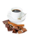 Cup of coffee, pieces of chocolate and spices isolated on white.