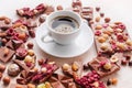 Cup of coffee with pieces of milk chocolate with nuts Royalty Free Stock Photo