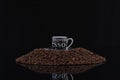 A cup of coffee on a pile of coffee beans Royalty Free Stock Photo