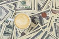 Cup of coffee on a pile of money. Royalty Free Stock Photo