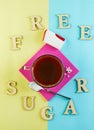 Cup of coffee and Pills of sugar substitute and natural sweetener in powder on a purple podium and the inscription free cugar Royalty Free Stock Photo