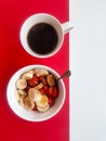 Cup of coffee and a plate of oatmeal with banana