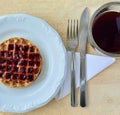 Cup of Coffee and plate with waffle