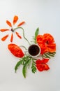 Cup of coffee and poppy flowers composition on a light gray background