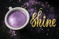 Cup of coffee with purple glitter on dark background with golden Royalty Free Stock Photo