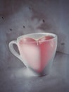 A cup of coffee with red heart inside. Full of love or love for coffee concept. Royalty Free Stock Photo