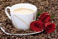 Cup of coffee and red roses Royalty Free Stock Photo