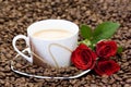 Cup of coffee and red roses Royalty Free Stock Photo