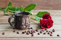 Cup of coffee and red roses on a wooden table Royalty Free Stock Photo