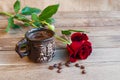 Cup of coffee and red roses on a wooden table Royalty Free Stock Photo