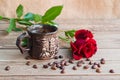 Cup of coffee and red roses on a wooden table Royalty Free Stock Photo