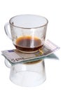 Cup with coffee residues and euro Royalty Free Stock Photo