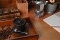 Coffee cup with roasted coffee beans and moka pot on wooden table. Royalty Free Stock Photo