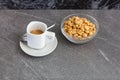 Cup of coffee and roasted nuts