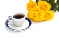 Cup of coffee on a saucer and a bouquet of yellow roses, the isolated image Royalty Free Stock Photo