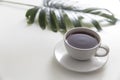 Cup of coffee with saucer with palm leaf Royalty Free Stock Photo