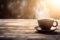 a cup of coffee on a saucer on a wooden table with the sun shining through the clouds in the background of the photo