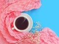 Cup of coffee, scarf romantic accessories color fashionable feminine morning on a colored background