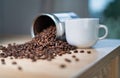 A cup of coffee and scattered coffee beans image Royalty Free Stock Photo