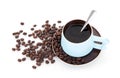 A cup of coffee and scattered coffee beans on white background