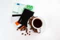 A cup of coffee, seeds, candy and money Royalty Free Stock Photo