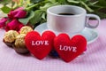 Cup of coffee, shape heart text love, chocolate, almonds