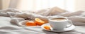 a cup of coffee is shown on a table next to a bed and coffee beans Royalty Free Stock Photo